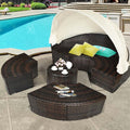 Round rattan wicker patio daybed with retractable canopy and cushions