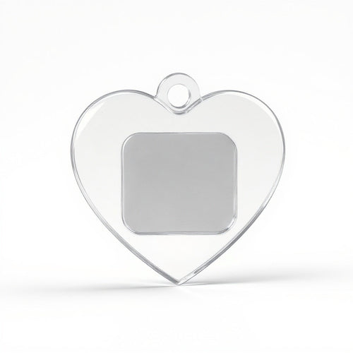 Close-up of clear acrylic material on heart-shaped keychain, macro texture shot